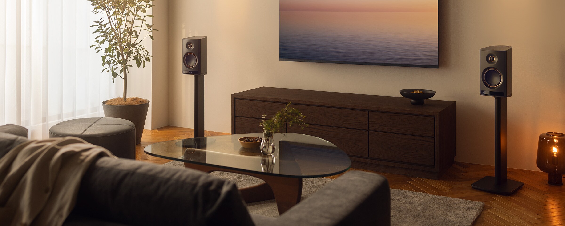 NX‑70A wireless Hi‑Fi speaker placed beside a TV in a modern living room