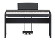 Front view of the P-125aB (black model) in combination with the optional stand and metal three-pedal pedal unit