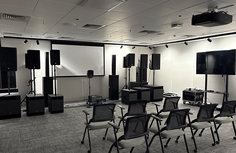 Bengaluru training facility room with presentation display, seating, and audio equipment.