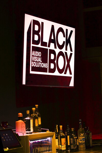 Black Box Audio Visual Solutions sign inside the venue.