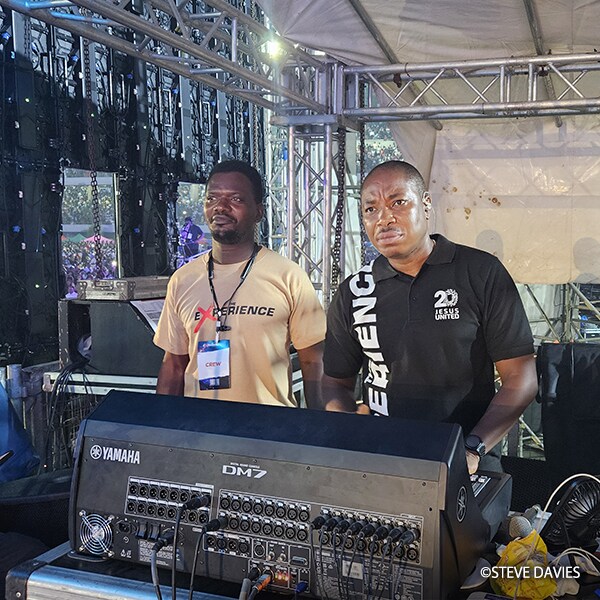House On The Rock engineers Ebenezer Odumlami and Gbogboade Pillar operating a Yamaha DM7 digital mixing console at the monitor position during The Experience 2025.